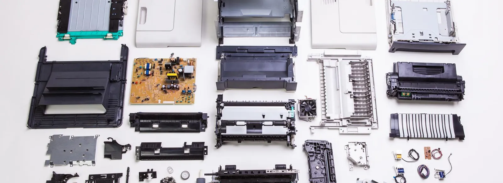 Photocopier parts laid out during a refurbishment